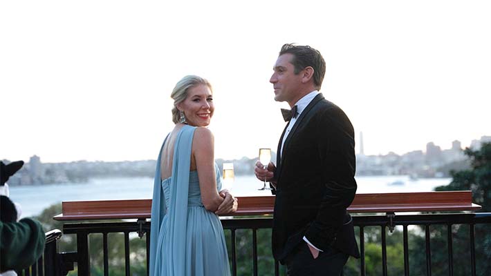 Guests having drinks on the verandah 